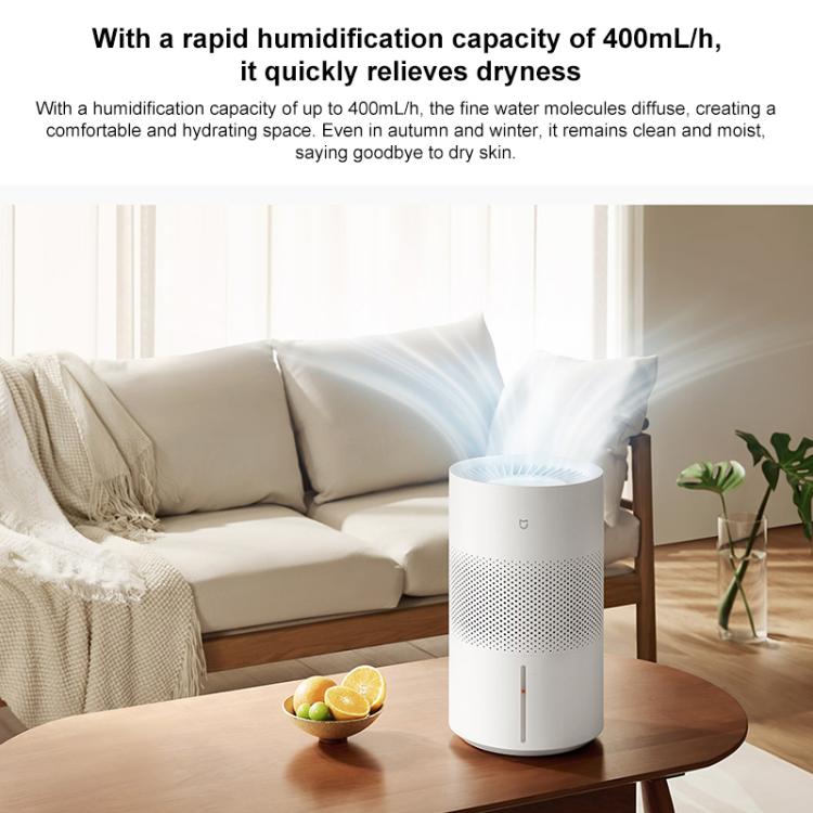White no-mist humidifier on a table with vented top and front indicator bar