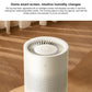 White no-mist humidifier close-up with circular fan vents and small display
