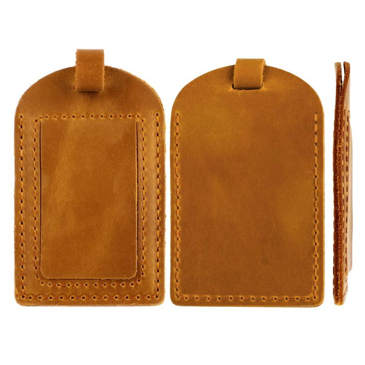 Pair of tan leather luggage tags with card pockets and stitched edges, buckled straps