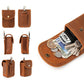Tan leather snap pouch with metal ring, shown with coins and cards inside