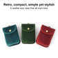 Leather key pouches with snap flap and metal ring, blue, green, and red