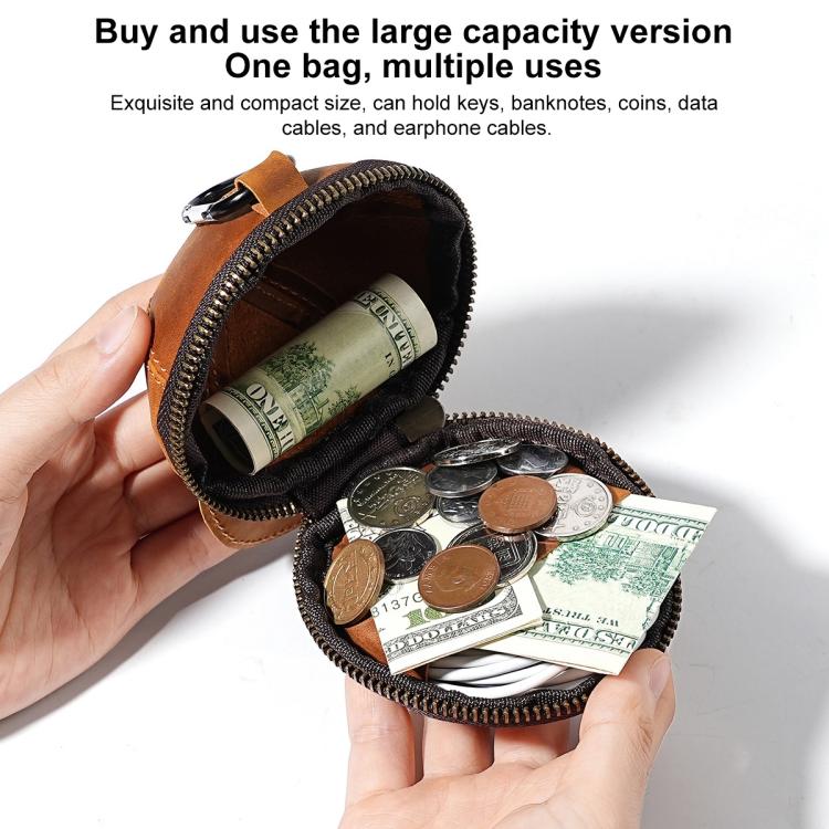 Black cap-style coin purse open with zipper, holding mixed coins and cash