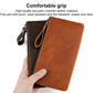 Vintage leather phone wallet clutch, brown, zip closure, wrist strap, hand-held view