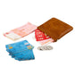 Brown leather coin purse holding cash and coins, hinged top with snap clasp