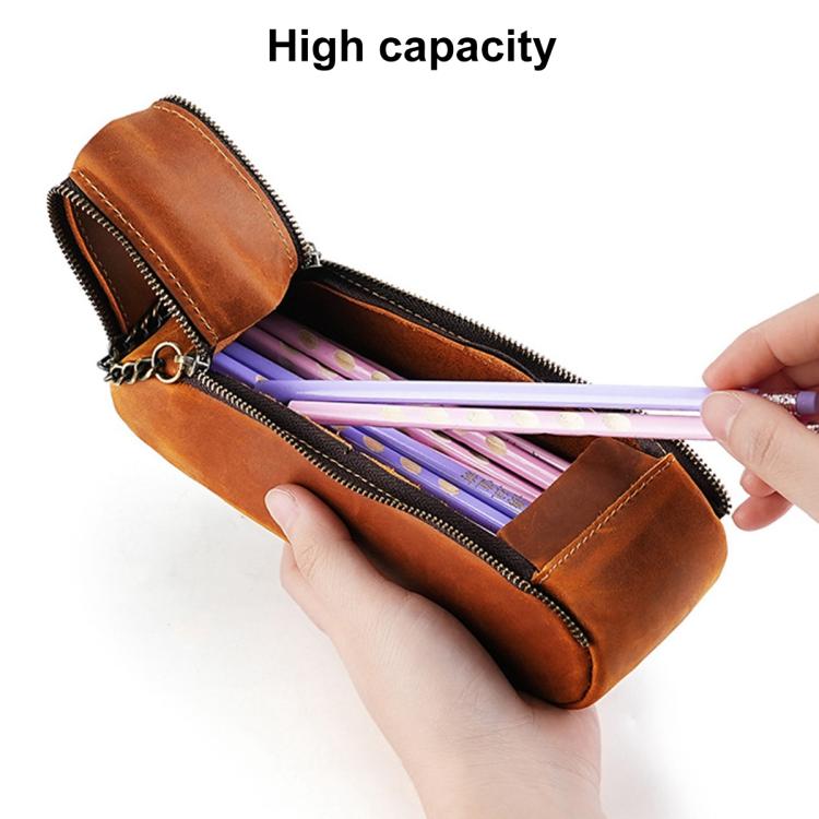 Orange leather pen pouch opened with pens inside, double zippers and chain strap