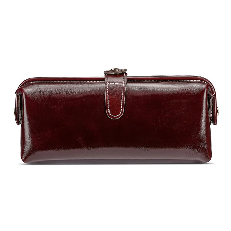 Coffee brown leather toiletry bag with top zipper, loop handle, and side tassel pulls