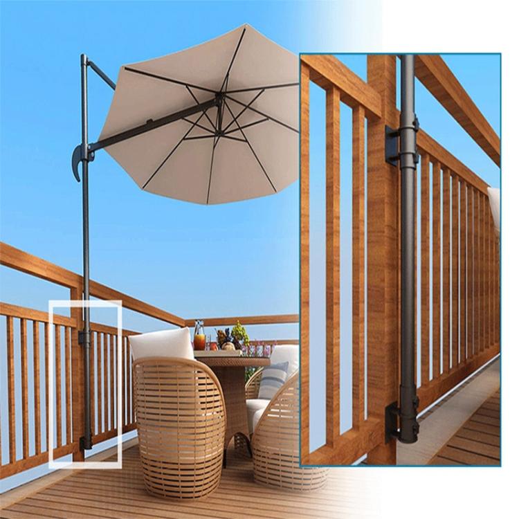 Metal umbrella holder mounted on patio railing posts with black bracket hardware
