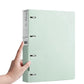 A4 four-hole document binder folder, mint green front held by hand at spine