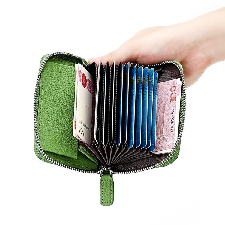 Green RFID leather zip coin purse held open, showing card slots and cash