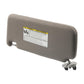 Gray right car sun visor with warning label and rear mounting brackets