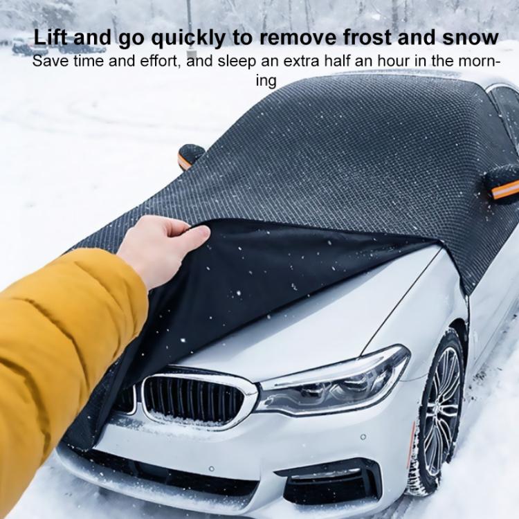 Hand lifting a dark car half cover over the front grille, with orange accent strip.