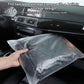 Folded storage pouch for the car cover, light gray protective bag in the vehicle.