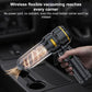 Black handheld car vacuum cleaner with nozzle used to blow debris from a car seat corner