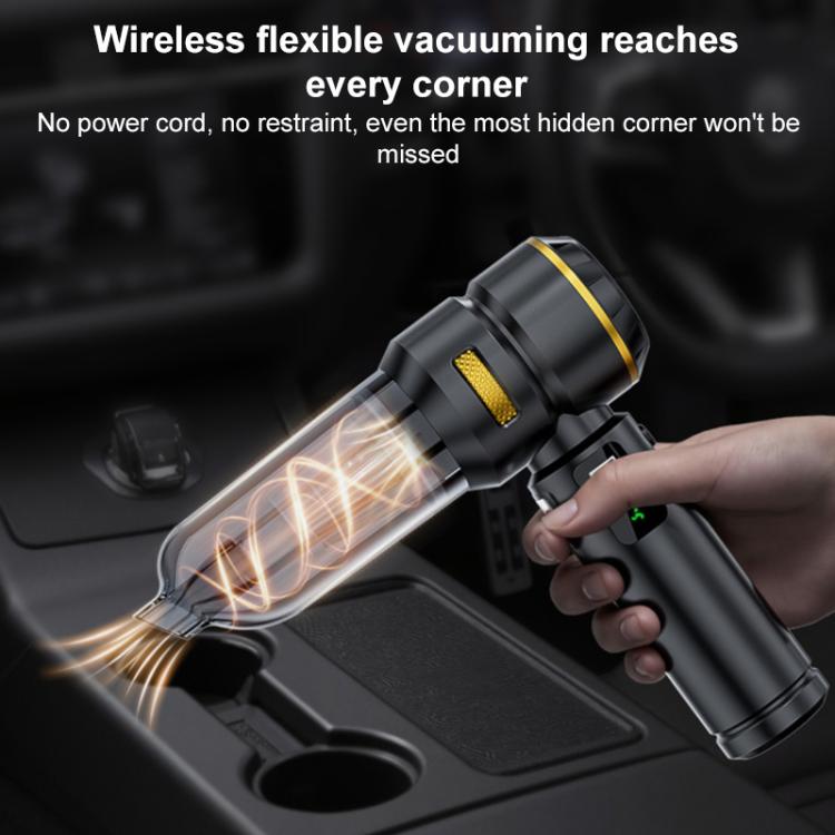 Black handheld car vacuum cleaner with nozzle used to blow debris from a car seat corner