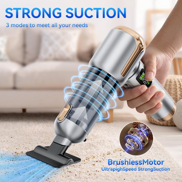 Handheld car vacuum cleaner in use with rotating brush head and visible dust bin