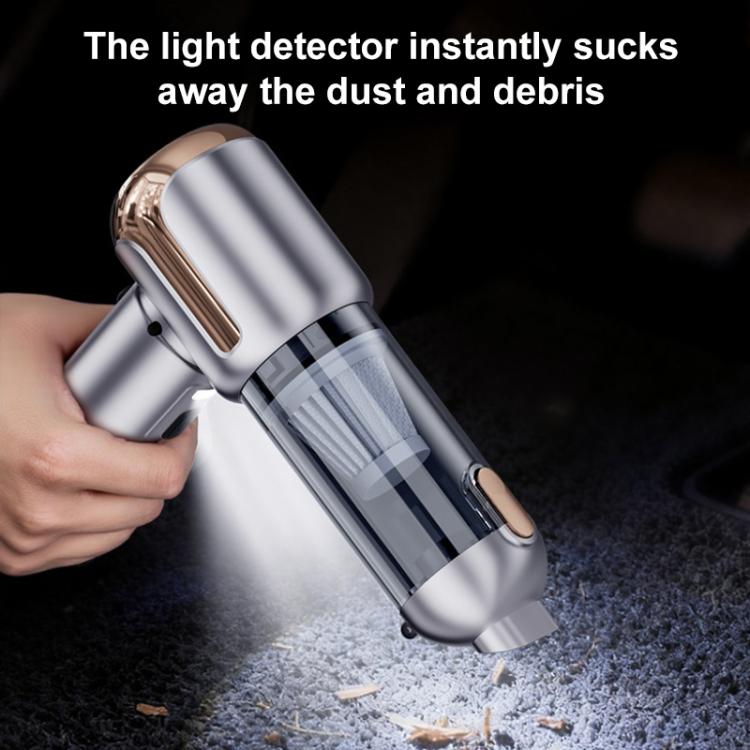 Handheld vacuum cleaner nozzle cleaning debris with visible dust collection canister