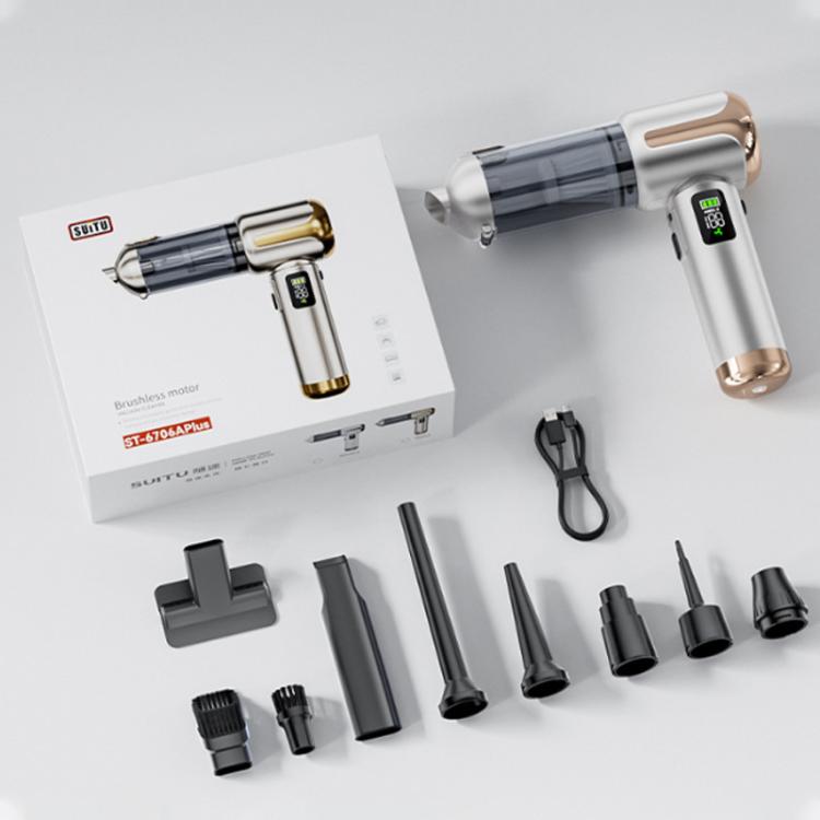 Handheld car vacuum cleaner with accessories and box on a white tabletop