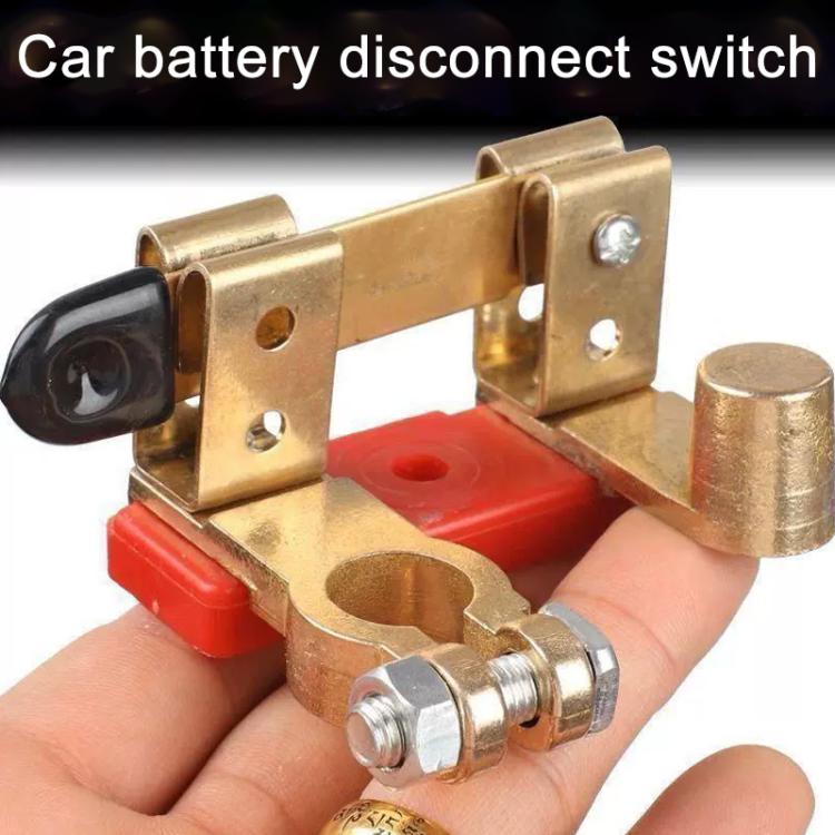 Brass negative battery disconnect switch held in hand, black insulated knob, red base