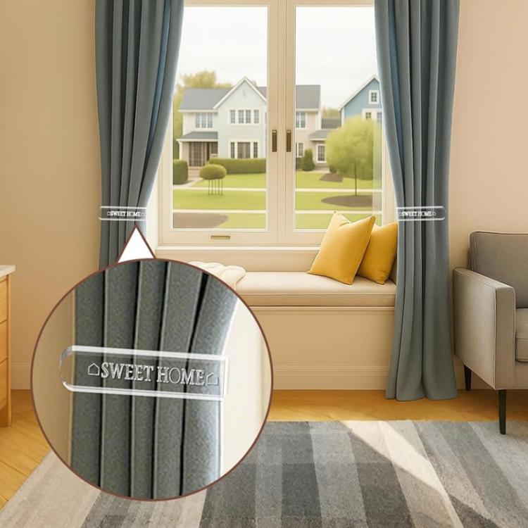 Clear acrylic curtain tieback holder clip on dark gray curtains, front close-up