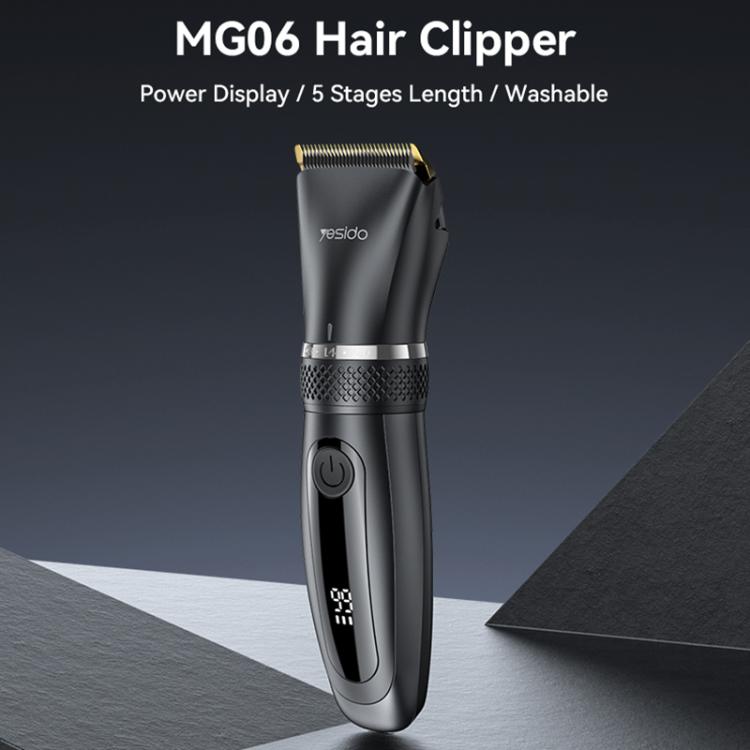 Black hair clipper with gold blade, side view, ergonomic grip and power button.