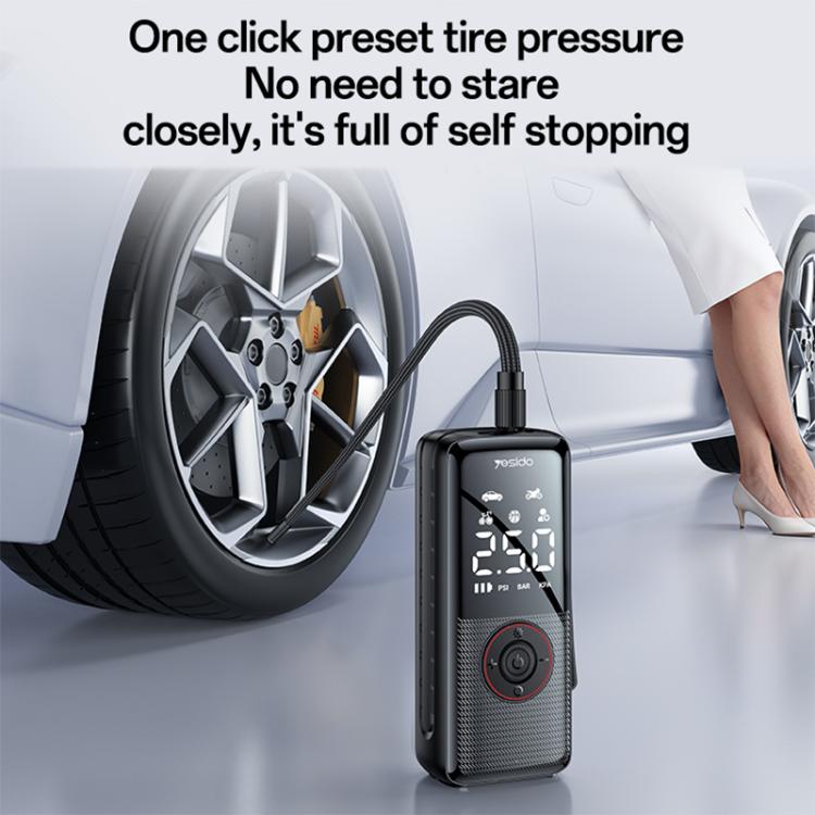 Yesido cordless tire inflator beside car wheel, showing LED pressure readout