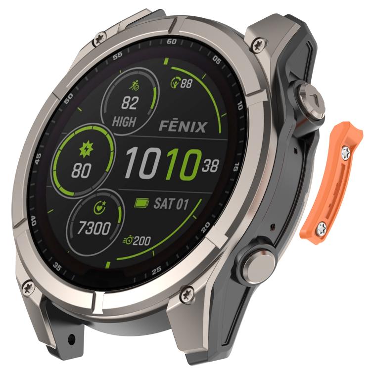 Orange metal watch bumper strip beside a Garmin watch, side view