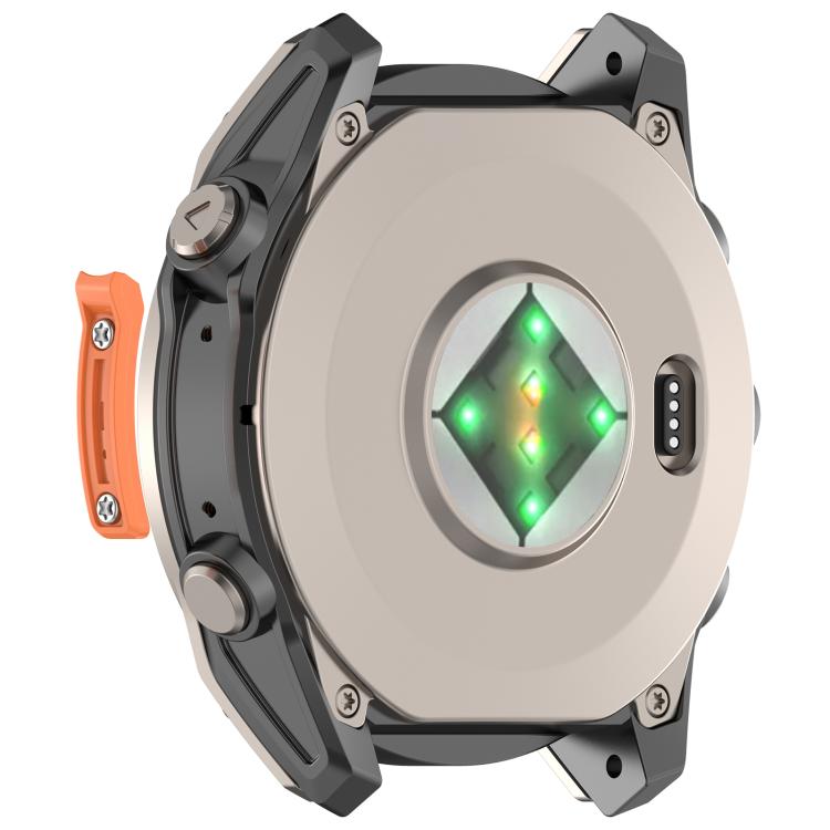Orange metal watch bumper strip beside the back of a Garmin watch