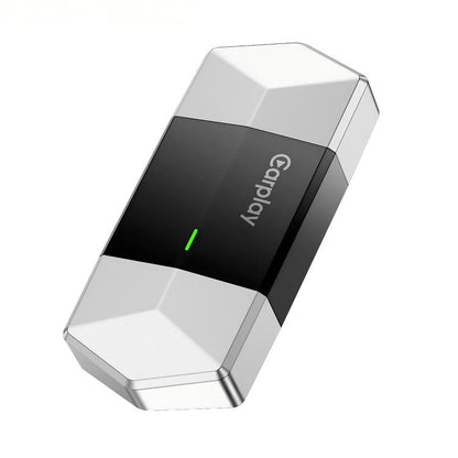 Car media adapter with CarPlay logo, white body and black top, green status light