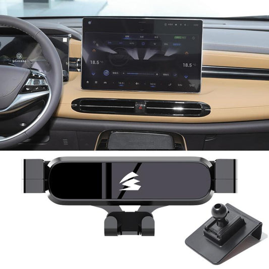 Car air vent metal gravity phone holder with side clamp grips, mounted in dashboard