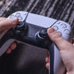 Hands attaching a dark silicone aiming ring to a controller thumbstick