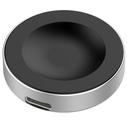 xDfind magnetic charging puck with black charging surface and silver edge