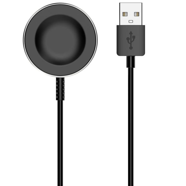 Close-up of black magnetic smartwatch charging puck and USB-A connector