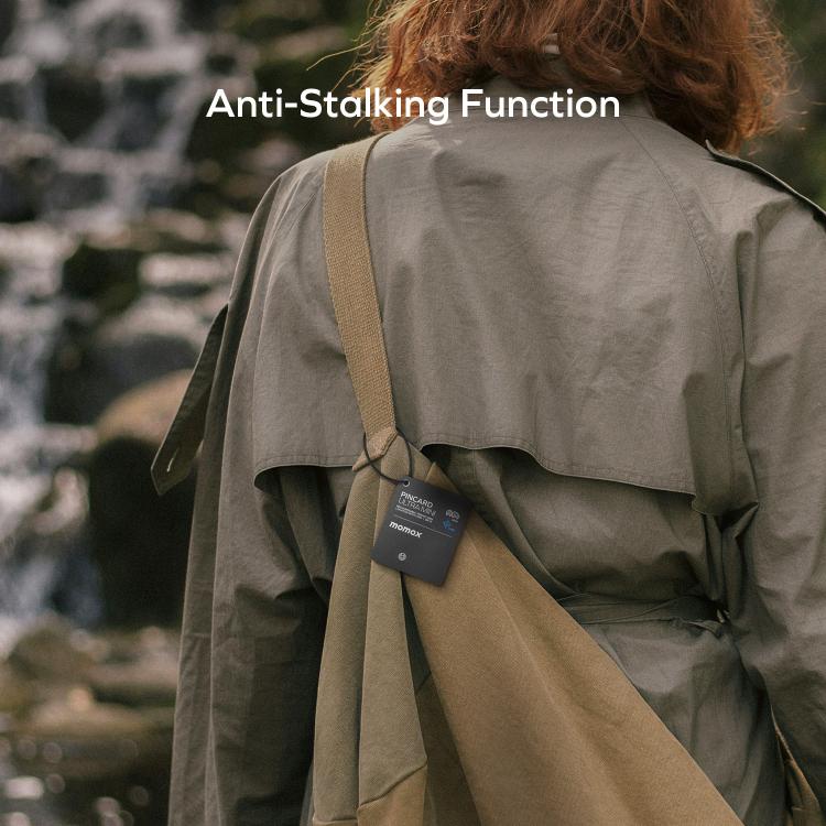 Black PINCARD Ultra Mini tag clipped to a backpack strap