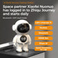 White smart robot toy standing upright with glowing face display and round clock panel