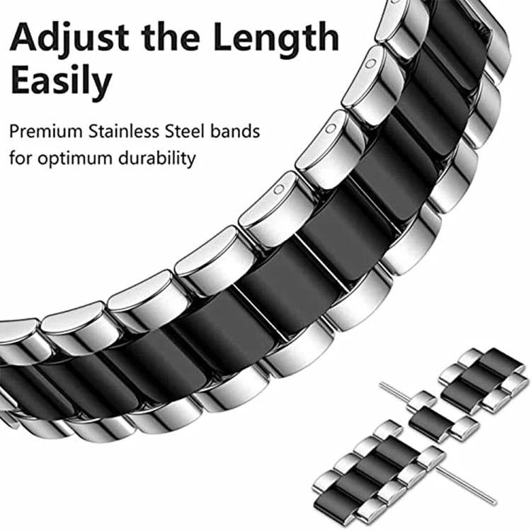 Close-up of silver and black stainless steel watch band links and removable link pins