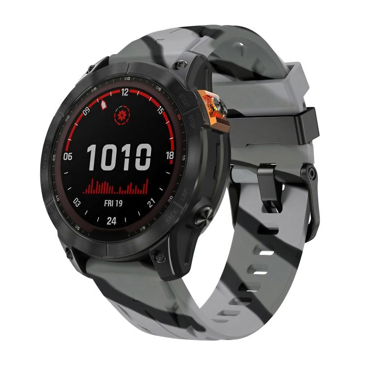 Gray and black camouflage silicone watch band with black pin buckle on a Garmin watch.