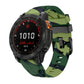 Green camouflage silicone watch band with black pin buckle on a Garmin watch.