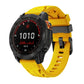 Yellow silicone watch band with black pin buckle, shown on a Garmin watch.