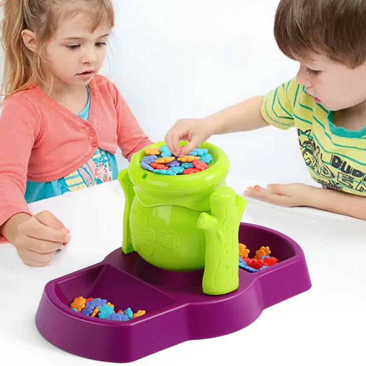 Bee balance sensory toy with green honey pot and purple board, colorful bee pieces in play