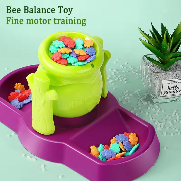 Bee balance sensory toy close-up with green honey pot and purple tray filled with bee pieces