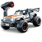Orange and white off-road remote control truck with wide grille and rugged tires