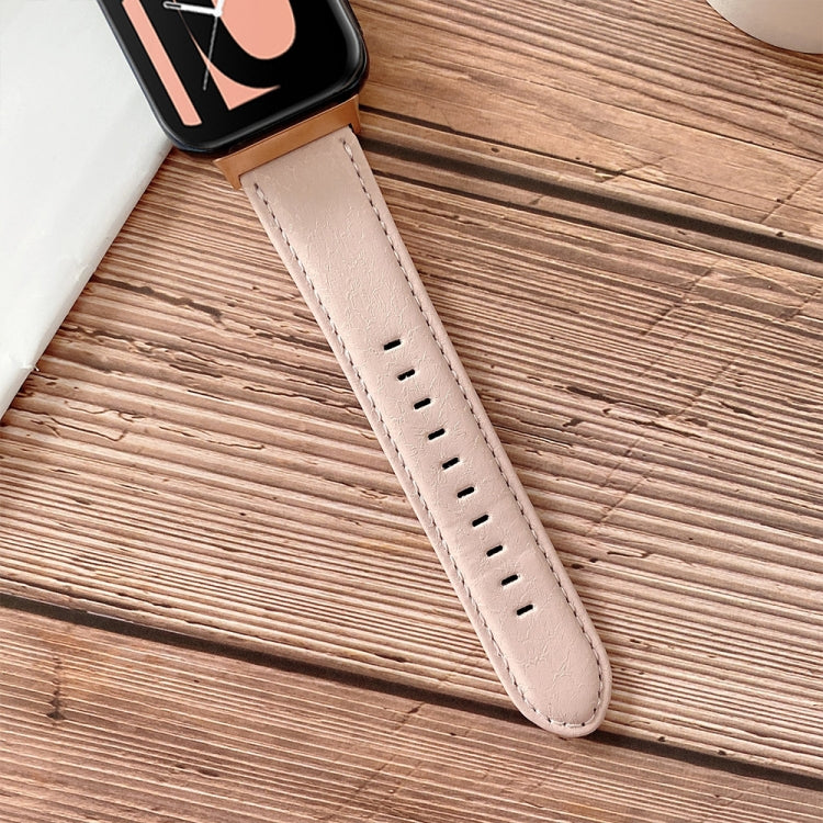 Light pink leather-look watchband with metal buckle and perforated strap holes