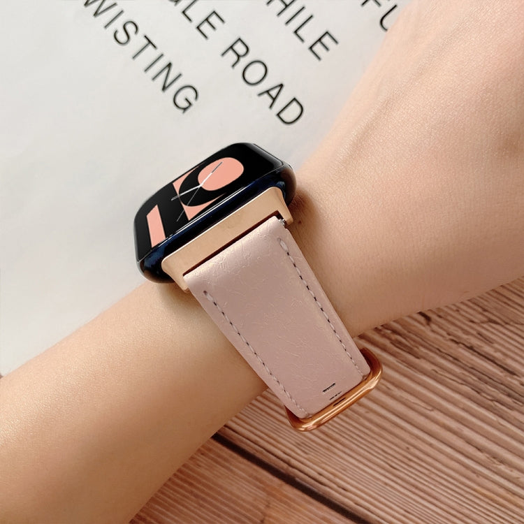 Pink shell-texture watch strap with gold buckle and black watch case