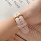 Light pink shell-texture watch strap with gold buckle and stitched holes