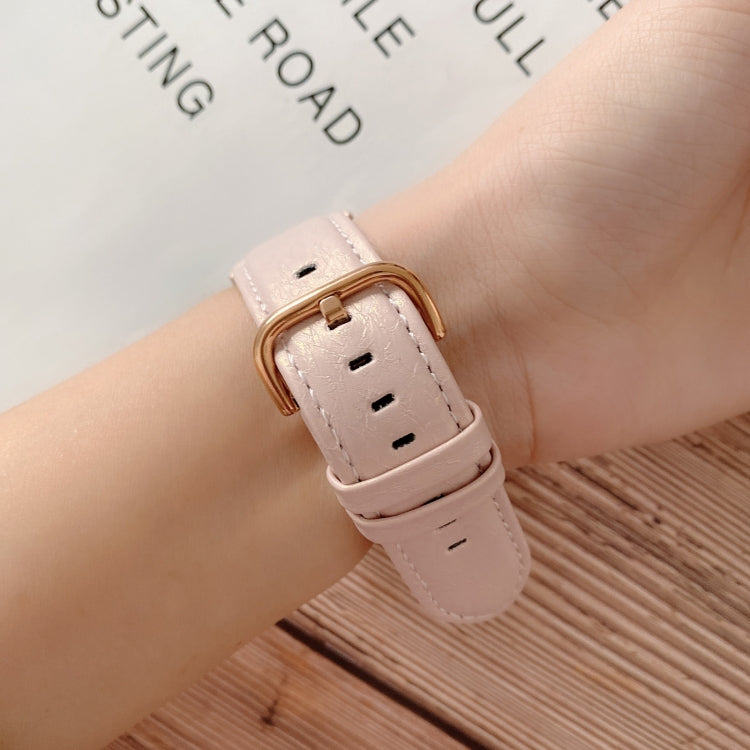 Light pink shell-texture watch strap with gold buckle and stitched holes
