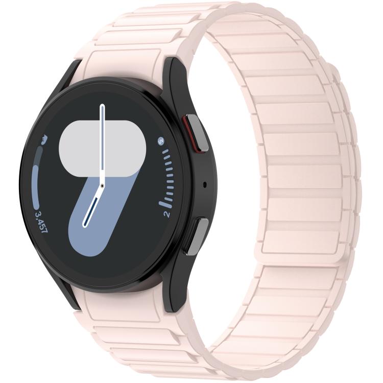 Pale pink silicone watch band with segmented links, fitted to a round smartwatch