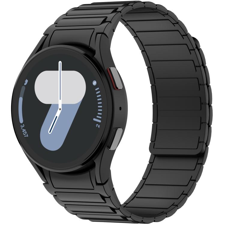 Black silicone watch band with segmented links, fitted to a round smartwatch