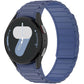 Dark navy silicone watch band with segmented links, fitted to a round smartwatch