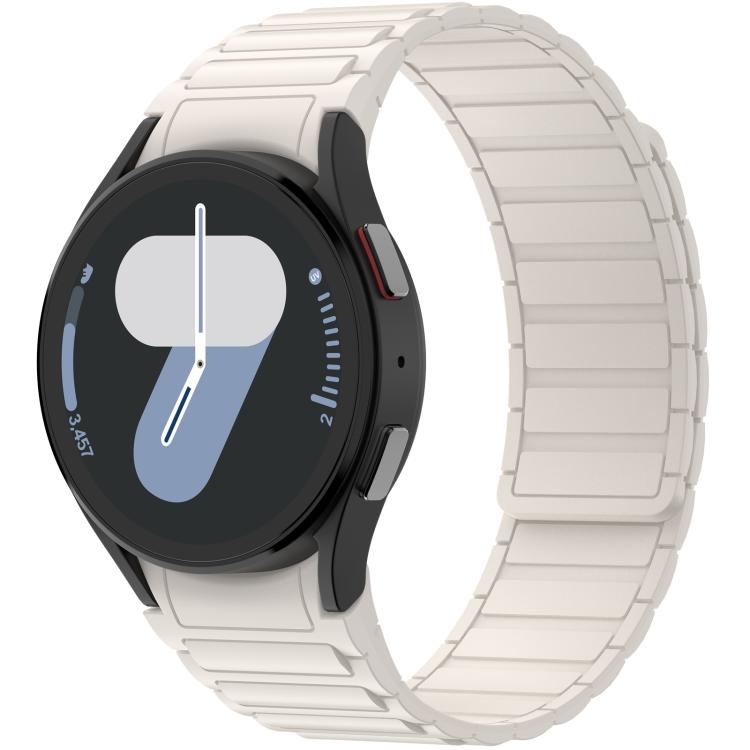 Magnetic silicone watch band in pale starlight, fitted to a black smartwatch