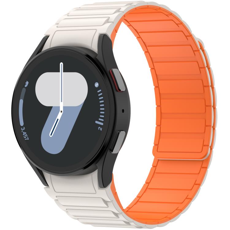 Magnetic silicone watch band with a pale outer side and bright orange inner side